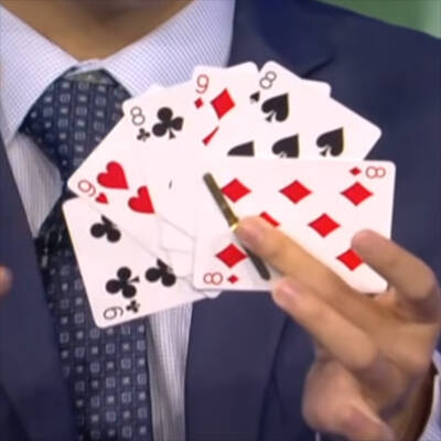 Stanley Zhou fanning a packet of cards.