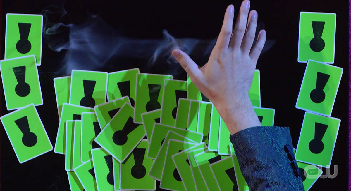 Green cards with keyholes and a key made of smoke.