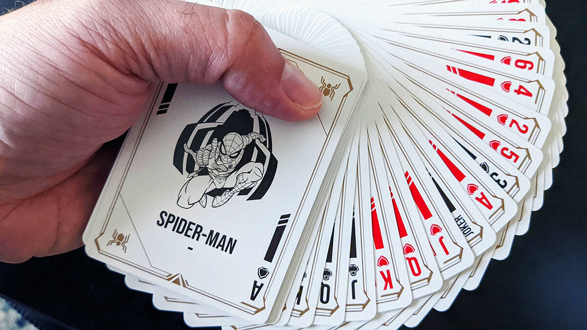 The Spider-Man deck fanned, face-up, to show off the custom design.