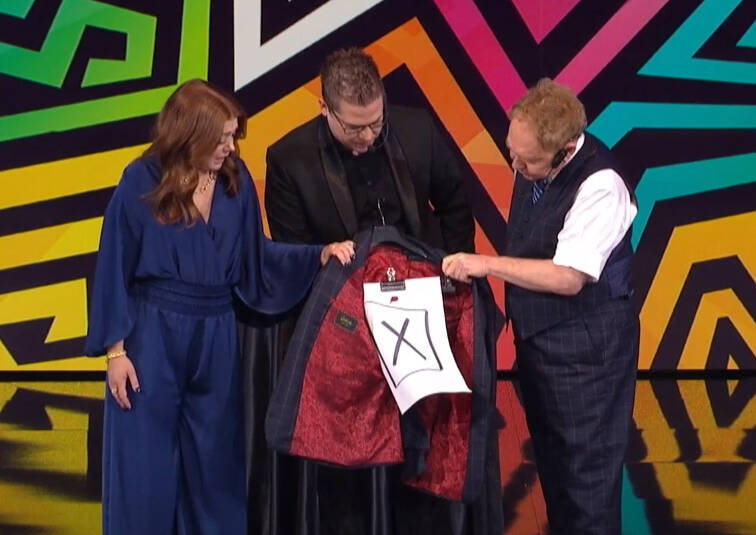 Luka, Teller, and Alyson examining the jacket after it was pierced by a knife.