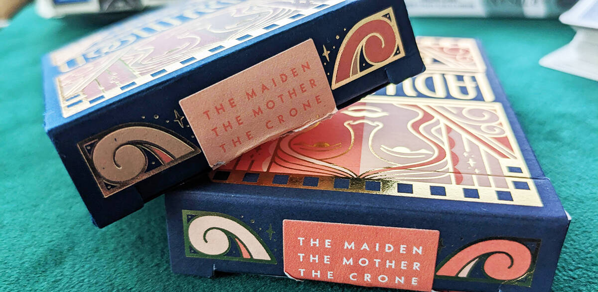 The two different sticker seal colors on the Lady Moon Play Cards decks.