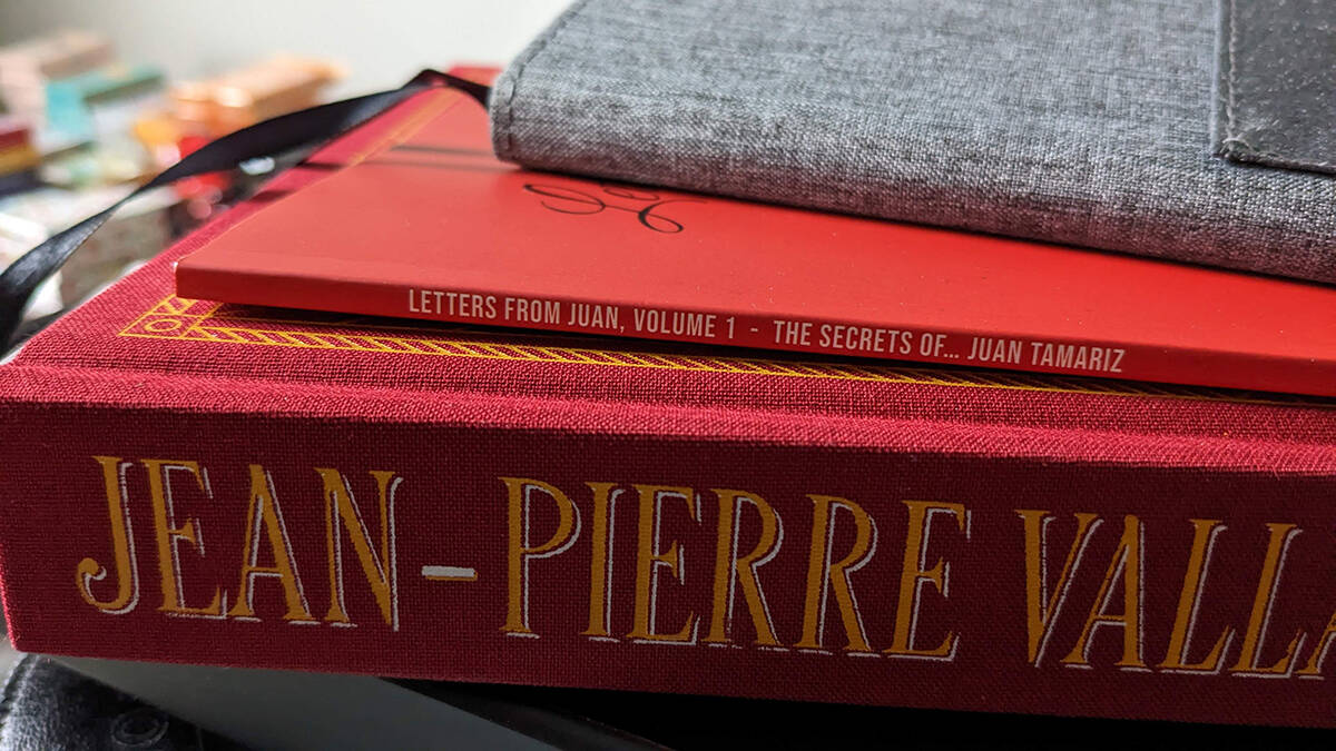 Magic books Letters from Juan, Vol. 1 and Jean-Pierre Vallarino.